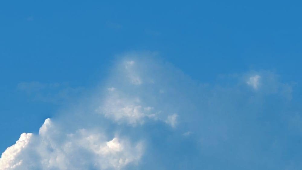 Photo of clouds illustrates the relief from chronic pains through mind-body treatments advanced by Dr. John Sarno.