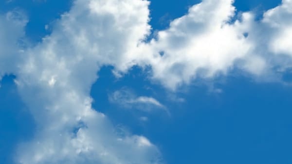 Photo of clouds shows how journaling can dissipate back pain and bring long-term relief.